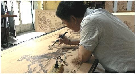 梅氏烙画：火与木的艺术
