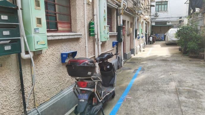 上海老小区破解电瓶车充电难题：从1比5到1比1.7的精细化治理