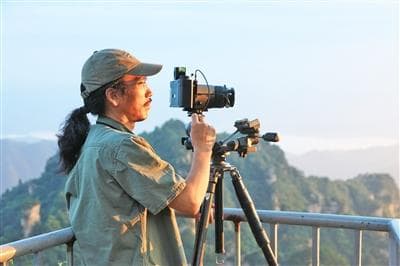 拍一片风景 客居他乡30年 周明发用镜头记录传播张家界的美